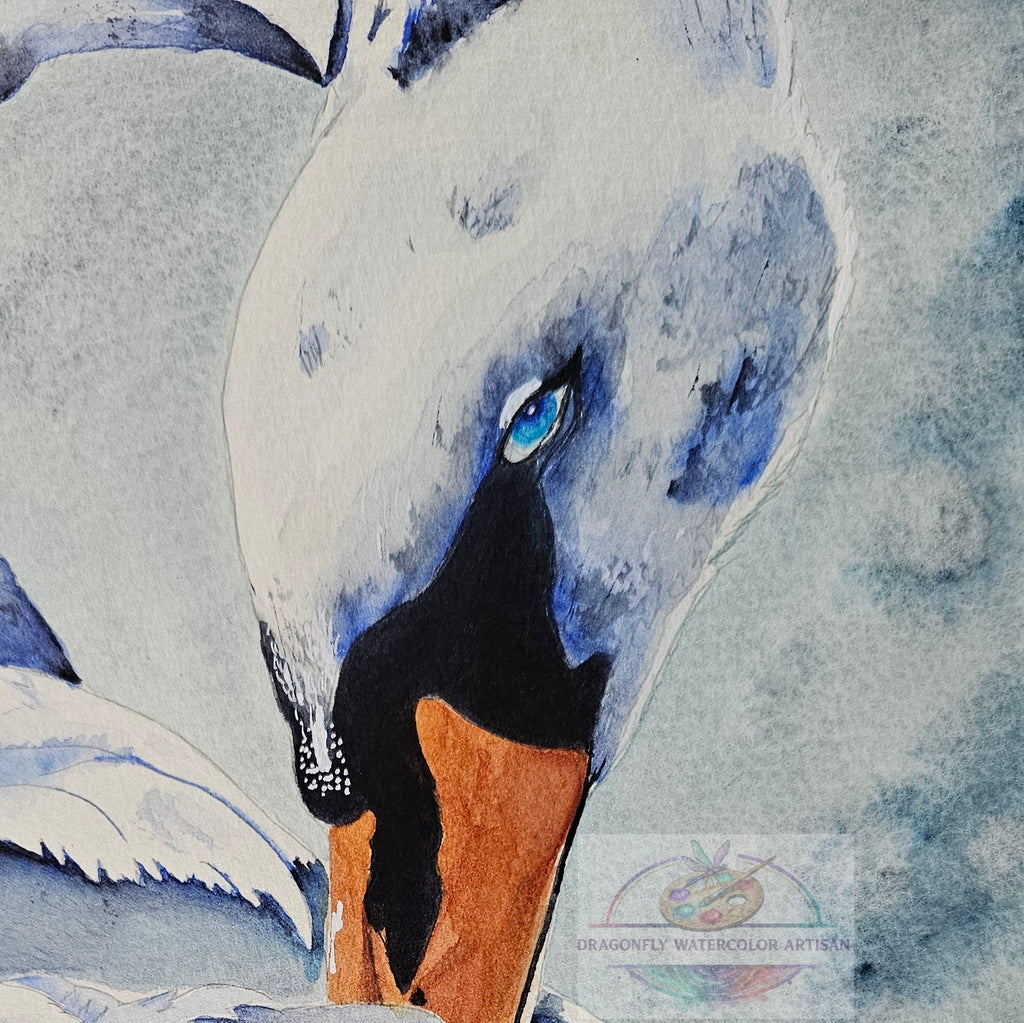 Close-up detail of the original watercolor swan painting, highlighting the striking bright blue eye, black and orange beak, and soft textured white and blue feathers.