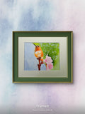 Original watercolor painting of a hummingbird in bloom perched on a branch with pink flowers by artist D. Bunting